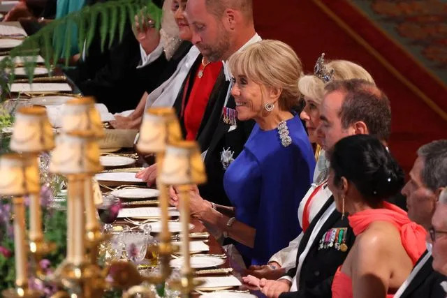 Ludovic Marin/Pool/AFP عبر Getty Prince William و Brigitte Machron و Queen Camilla يجلسون أمام أزواجهما في الولاية في 8 يوليو 2025