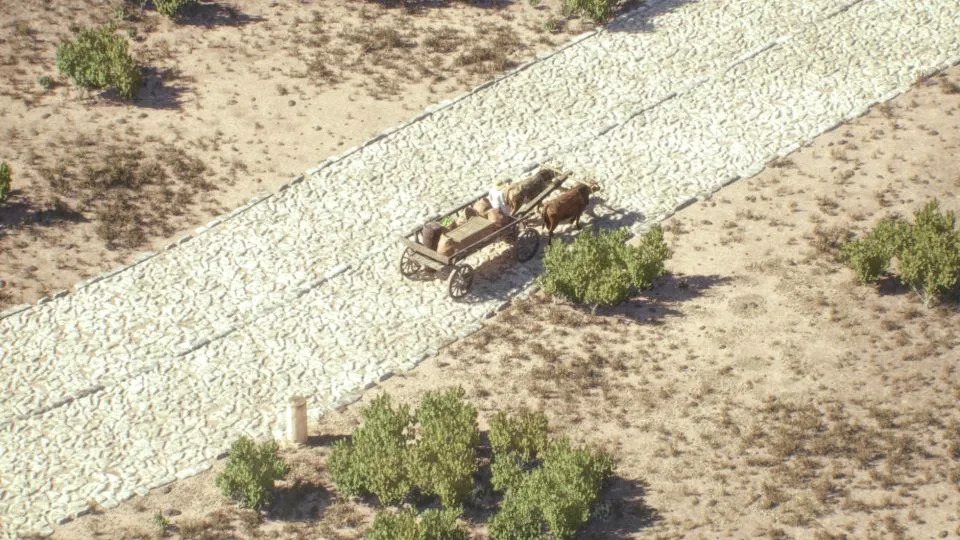 عربة تتنقل عبر طريق روماني بممرات اتجاهية في صورة مقدمة من Itiner-e مأخوذة من رسم متحرك. - إيتينر-إي/أرتاس ميديا/مينيرفا