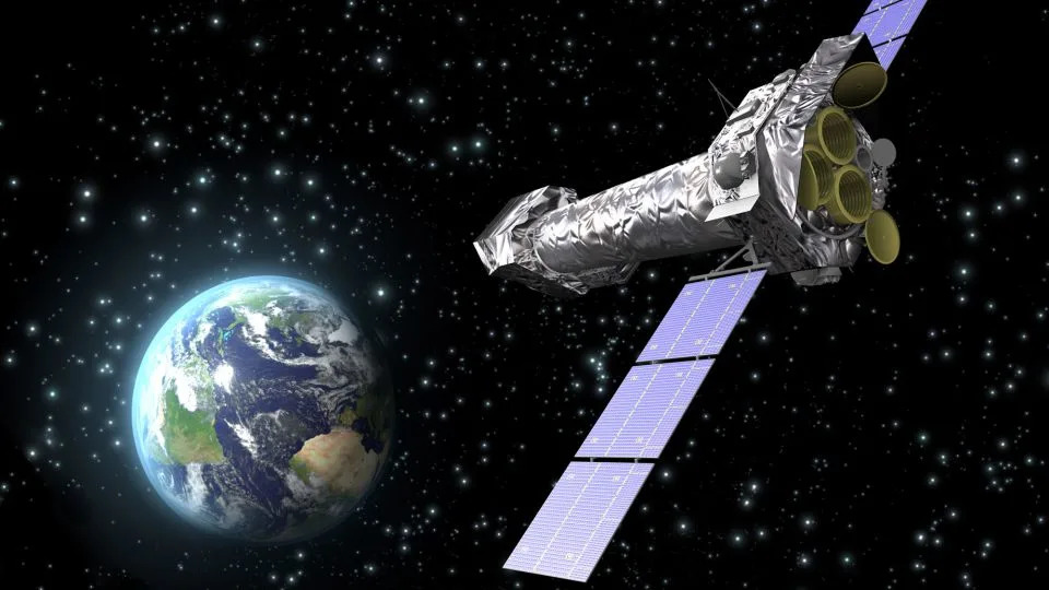 رسم توضيحي للفنان يصور مرصد XMM-Newton في الفضاء. - وكالة الفضاء الأوروبية/C. كارو