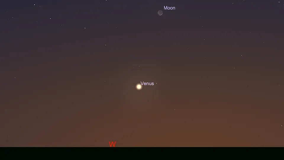 صورة سماء ليلية مُسمى بسماء ليلية برتقالية وأرجوانية حيث توجد نقطة متوهجة في المنتصف تحمل اسم كوكب الزهرة بنص أبيض وفي الجزء العلوي من الصورة توجد نقطة مُسمى للقمر