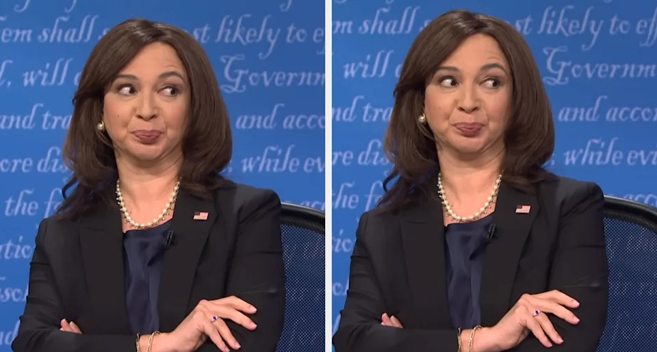 شخص يرتدي سترة مع عقد من اللؤلؤ ويظهر تعبيرات فكاهية، محاكاة ساخرة على الأرجح. نص الخلفية باهت وغير مرئي بالكامل